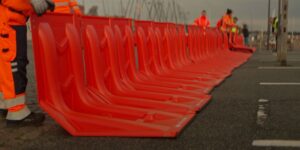 Aligning the EasyWall water diversion flood barriers.